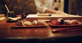 Sushi, plate and serving with chef in restaurant for luxury cuisine or raw meal preparation closeup. Kitchen, food and