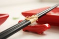 Sushi plates with chopsticks on the white table Royalty Free Stock Photo