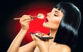 Sushi. Portrait of beauty model girl eating sushi Royalty Free Stock Photo