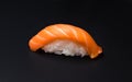 Sushi, rice, fish, salmom, black background Royalty Free Stock Photo