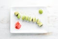 Sushi roll with avocado, cucumber and tomato. Japanese cuisine.