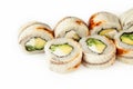 Sushi roll Black dragon on a white background, ingredients Eel, cream cheese, avocado, cucumber, teriyaki sauce, sesame Royalty Free Stock Photo