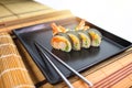 Sushi roll on a black plate ready to be served Royalty Free Stock Photo