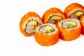 Sushi roll California roll on a white background, ingredients Shrimp, cucumber, avocado, flying fish roe, rice, nori Royalty Free Stock Photo