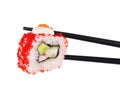 Sushi roll in chopsticks Isolated Royalty Free Stock Photo