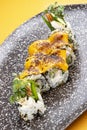 Sushi roll with crab under melted cheese. Sushi trend. Creative food