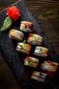 Sushi roll with cream cheese and eel in plate on wooden table Royalty Free Stock Photo