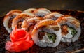 Sushi roll with cream cheese and eel in plate on wooden table Royalty Free Stock Photo