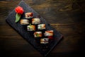 Sushi roll with cream cheese and eel in plate on wooden table Royalty Free Stock Photo