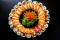 a sushi roll cut into pieces displayed in a circular pattern Royalty Free Stock Photo