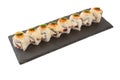 Sushi Roll with Fresh fish and Avocado on a slate slab on white background