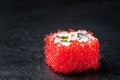Sushi roll of fresh shrimps cucumber avocado red Tobiko caviar and Philadelphia Royalty Free Stock Photo