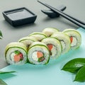 Sushi Roll Fresh with smoked salmon, cream cheese and vegetables. Decorated with greenery. In the background is a gravy boat and