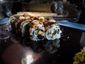 Sushi roll with grilled salmon - prawn, avocado, cream cheese. Sushi Japanese menu Royalty Free Stock Photo