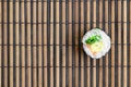Sushi roll lie on a bamboo straw serwing mat. Traditional Asian food. Top view. Flat lay minimalism shot with copy space