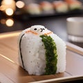 A sushi roll that looks like a snowman, with rice body and nori eyes2 Royalty Free Stock Photo