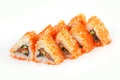 Sushi Roll - Maki Sushi made of Smoked Eel, Cream Cheese, Salmon and Deep Fried Vegetables inside, isolated on white background Royalty Free Stock Photo