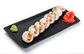 Sushi Roll - Maki Sushi with red caviar, Crab meat, salmon, cucumber, avocado and cream cheese on black plate Royalty Free Stock Photo
