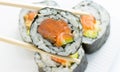 Sushi roll in nori with ginger and wasabi on white plate Royalty Free Stock Photo