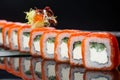 Sushi roll (Philadelphia) with salmon smoked eel avocado cream cheese on black background. Sushi menu. Japanese food Royalty Free Stock Photo