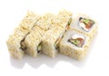 Sushi roll with salmon cheese and vegetables rolled in sesame isolated Royalty Free Stock Photo