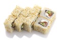 Sushi roll with salmon cheese and vegetables rolled in sesame isolated Royalty Free Stock Photo