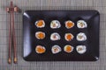 Sushi roll with salmon, cucumber, avocado, red caviar. Sushi menu. Japanese food. Close up, top view Royalty Free Stock Photo