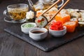 Sushi Roll with salmon, eel, tuna, avocado, cream cheese Philadelphia, caviar tobica, chuka. Sushi menu. Japanese food on table Royalty Free Stock Photo