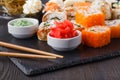 Sushi Roll with salmon, eel, tuna, avocado, cream cheese Philadelphia, caviar tobica, chuka. Sushi menu. Japanese food on table Royalty Free Stock Photo