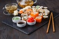 Sushi Roll with salmon, eel, tuna, avocado, cream cheese Philadelphia, caviar tobica, chuka. Sushi menu. Japanese food on table Royalty Free Stock Photo