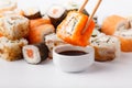 Sushi Roll with salmon, eel, tuna, avocado, cream cheese Philadelphia, caviar tobica, chuka. Sushi menu. Japanese food on table Royalty Free Stock Photo