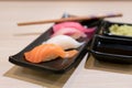 Sushi roll with salmon and and fresh mix sushi set in black plate - Japanese food set style at Japanese restaurant Royalty Free Stock Photo