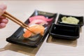 Sushi roll with salmon and and fresh mix sushi set in black plate - Japanese food set style at Japanese restaurant Royalty Free Stock Photo