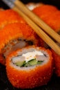 Sushi roll with salmon, smoked eel, avocado, cream cheese. Sushi menu. Japanese food