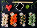 Sushi and sushi roll set on black stone table. Royalty Free Stock Photo