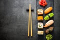 Sushi and sushi roll set on black stone table top view Royalty Free Stock Photo