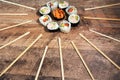 Sushi roll set with chopsticks. Japan sun concept. Royalty Free Stock Photo