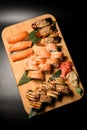 Sushi roll set consisting of grilled nigiri and tuna rolls, shrimp philadelphia and salmon nigiri Royalty Free Stock Photo