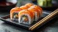A sushi roll, on a small, square black plate, with chopsticks aligned parallel. Generative AI Royalty Free Stock Photo