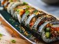 A sushi roll with vegetables and sesame seeds