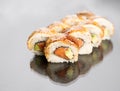 Sushi roll at white background with reflection. Japanese seafood sushi Royalty Free Stock Photo