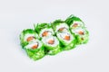 Sushi Roll wrapped in rice and Hiyashi wakame chuka chukka seaweed isolated on gray background