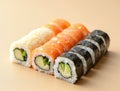 Sushi Rolls Arranged in a Vertical Gradient Transitioning from Light Cucumber Rolls to Dark Eel Rolls Royalty Free Stock Photo