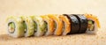 Sushi Rolls Arranged in a Vertical Gradient Transitioning from Light Cucumber Rolls to Dark Eel Rolls Royalty Free Stock Photo