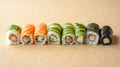 Sushi Rolls Arranged in a Vertical Gradient Transitioning from Light Cucumber Rolls to Dark Eel Rolls Royalty Free Stock Photo