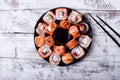 Sushi rolls assortment and soy sauce served on round plate Royalty Free Stock Photo