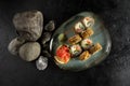 Sushi rolls baked in batter with salmon and salad. Royalty Free Stock Photo