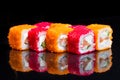 Sushi rolls california on a black background.