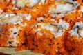 Sushi rolls california with snow crab, cream cheese, cucumber, sesame seeds and masago caviar macro close up Royalty Free Stock Photo