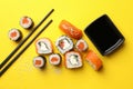 Sushi rolls, chopsticks and soy on background, top view Royalty Free Stock Photo